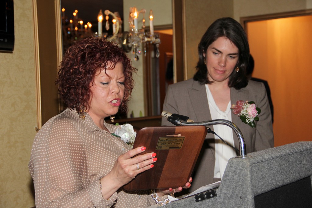 CGA Board Treasurer Patricia Ruiz presents Jill Eisenhard, Executive Director of Red Hook Initiative, with the Public Service Award.